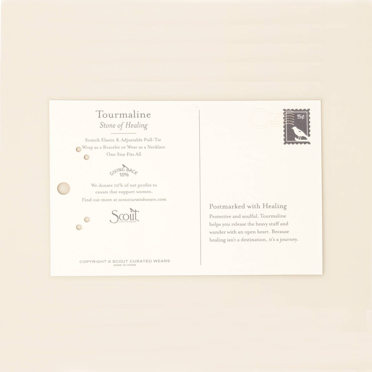 An elegant postcard featuring the Scout Curated Wears branding, with a minimal design on a pale background, describes Tourmaline stone and its healing properties. A small black stamp appears in the upper right corner. The card highlights how Tourmaline pairs beautifully with Japanese Miyuki Beads or organic pearls—perfect for accenting your favorite Mixed Media Wrap Bracelet/Necklace - Healing/Tourmaline/Gold from Scout Curated Wears.
