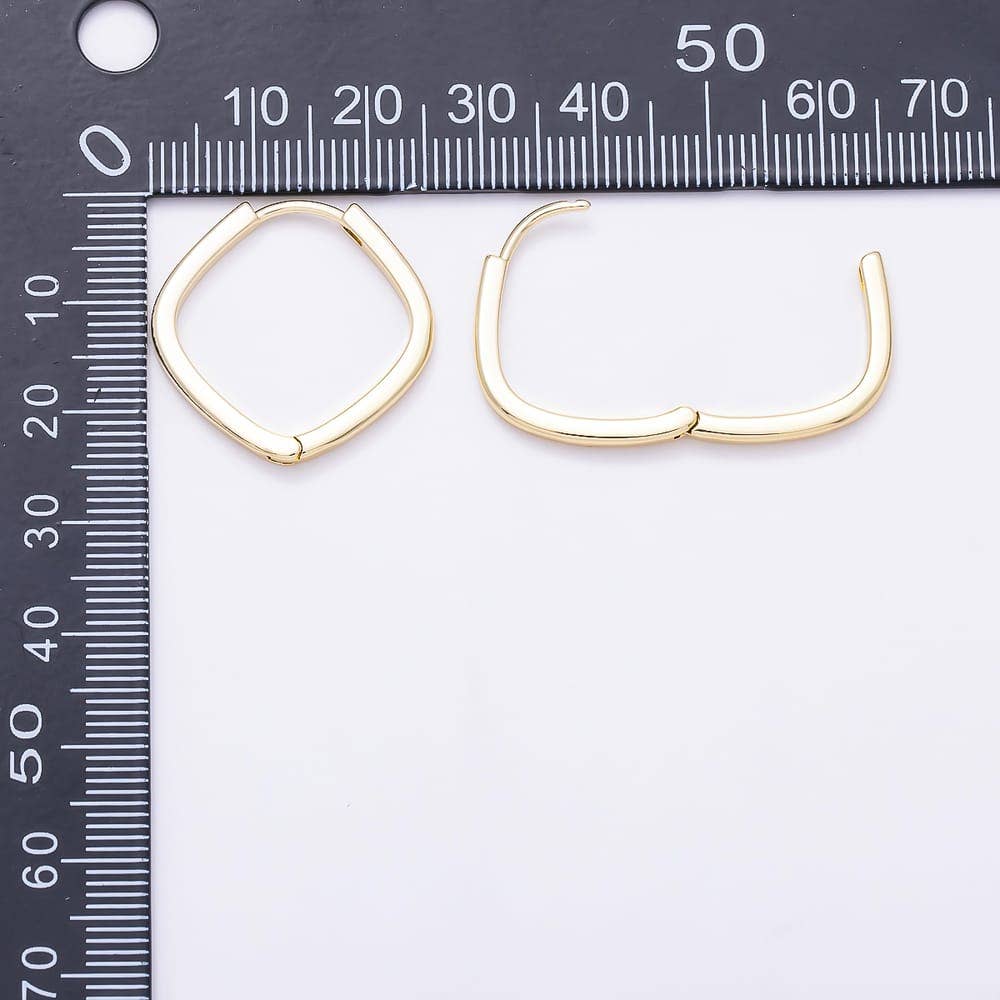 Aim Eternal Gold Filled 25mm Square Huggie Hoop Earrings shown next to a measuring ruler.