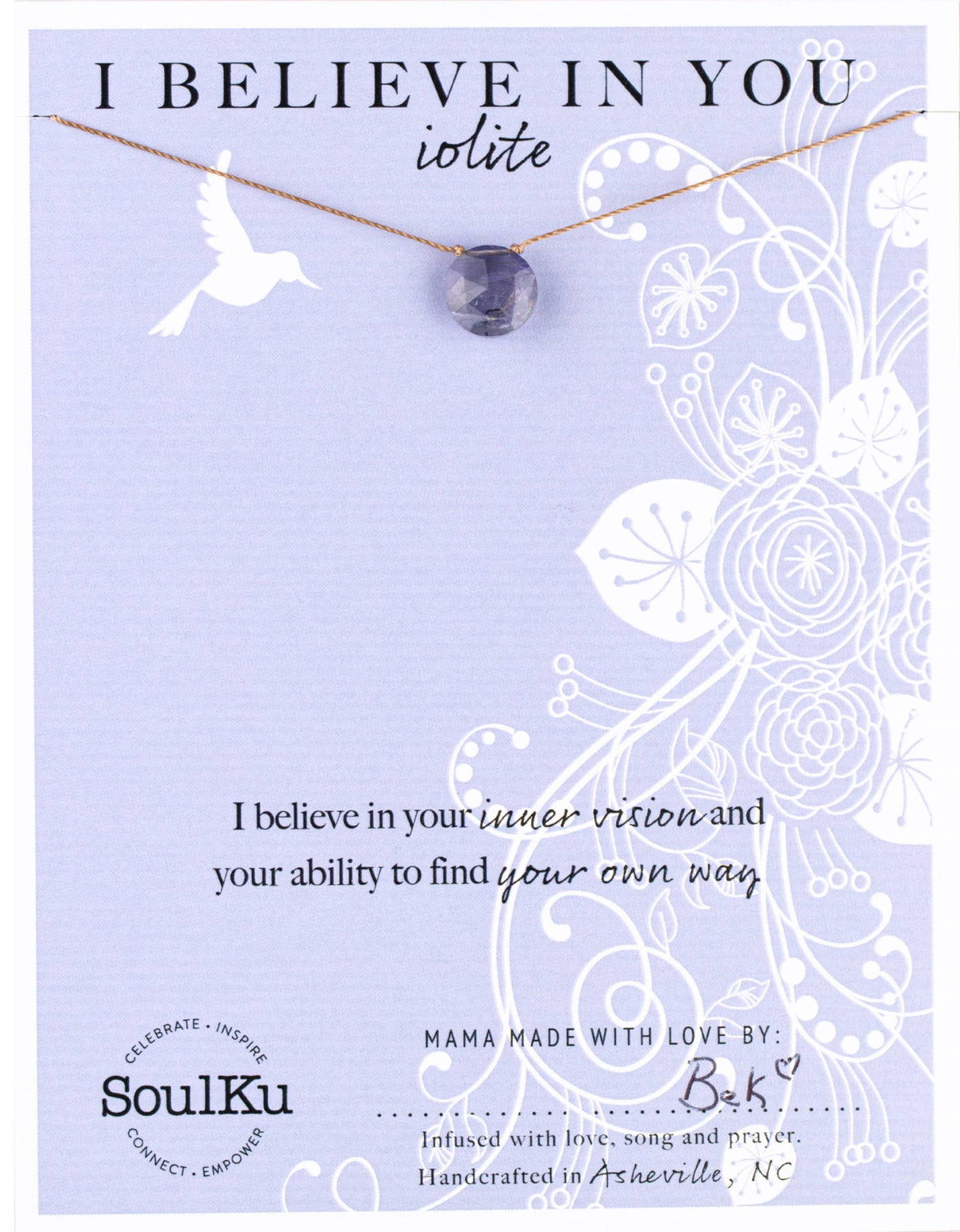 The SoulKu Iolite Beam Necklace for ‘I Believe in You’ features an iolite gemstone on a card with white florals, a flying dove, and words of encouragement—ideal for clarity, intuition, and inspiration.