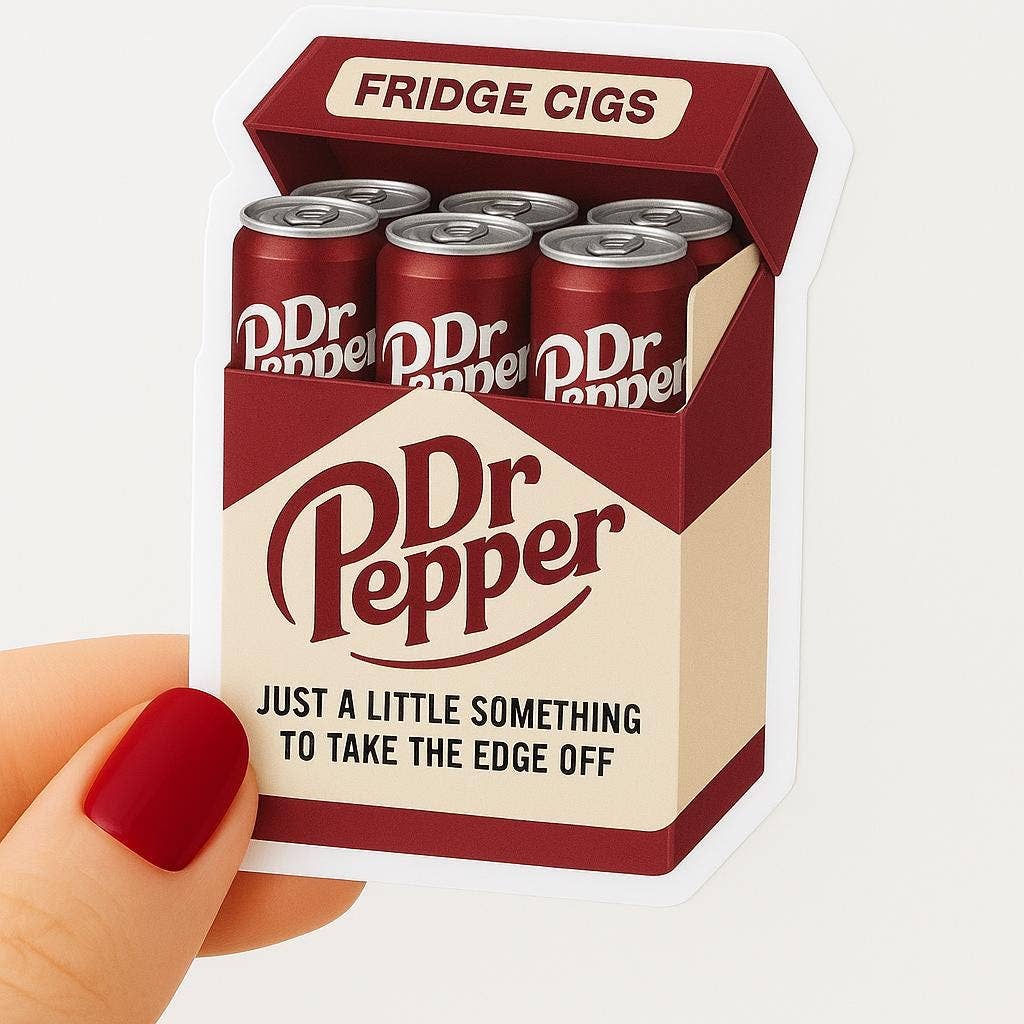 A hand with red nails holds the Dr Pepper Fridge Cigs Sticker by Hello Brand | Sticker My Art, a weather-resistant vinyl sticker featuring a soda can pack styled like a cigarette box with playful text.