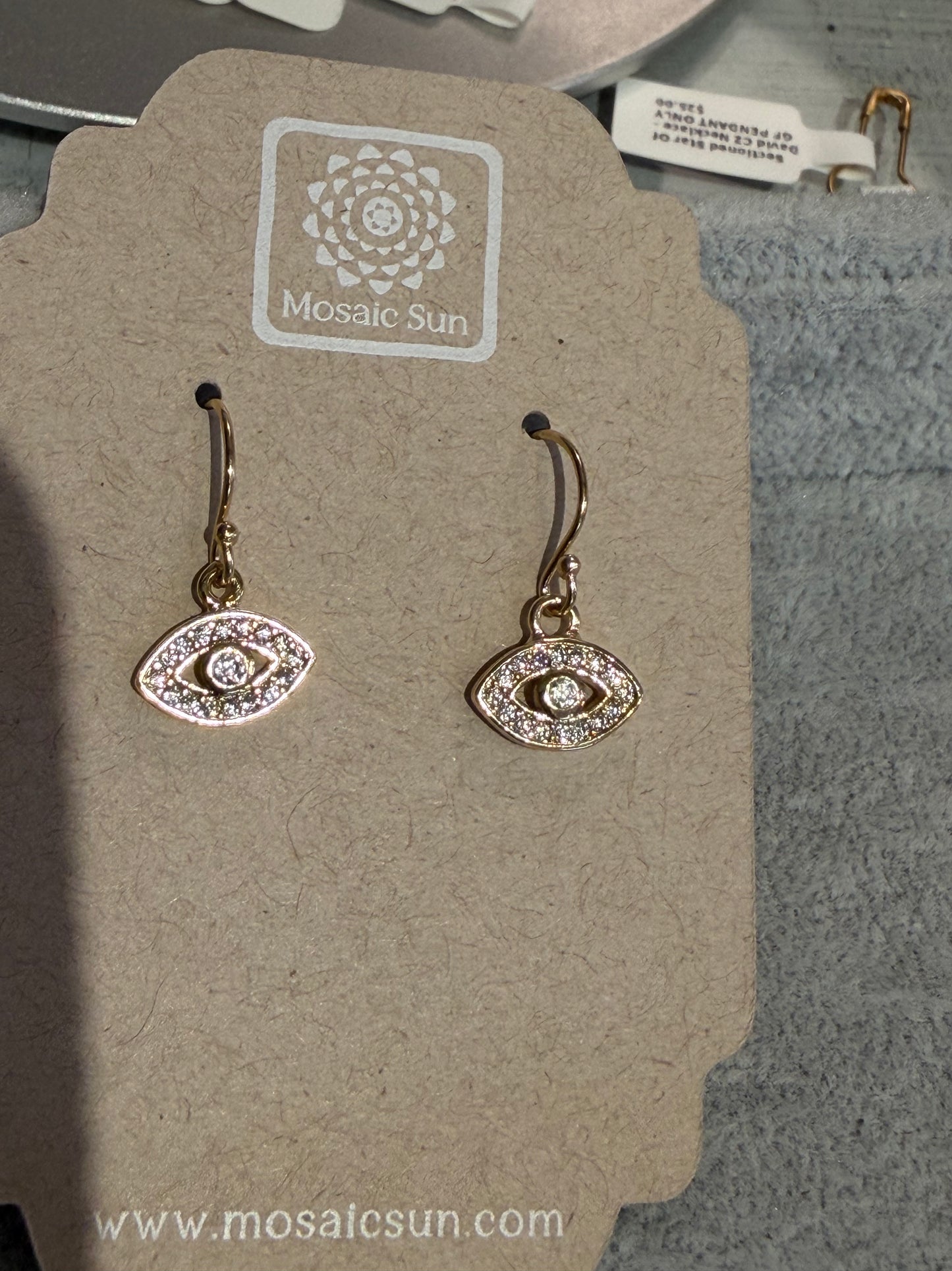 DIYH Eye Shape CZ Earrings - GF: gold eye-shaped earrings with sparkling stones, shown on a beige Mosaic Sun card. www.mosaicsun.com appears at the bottom.