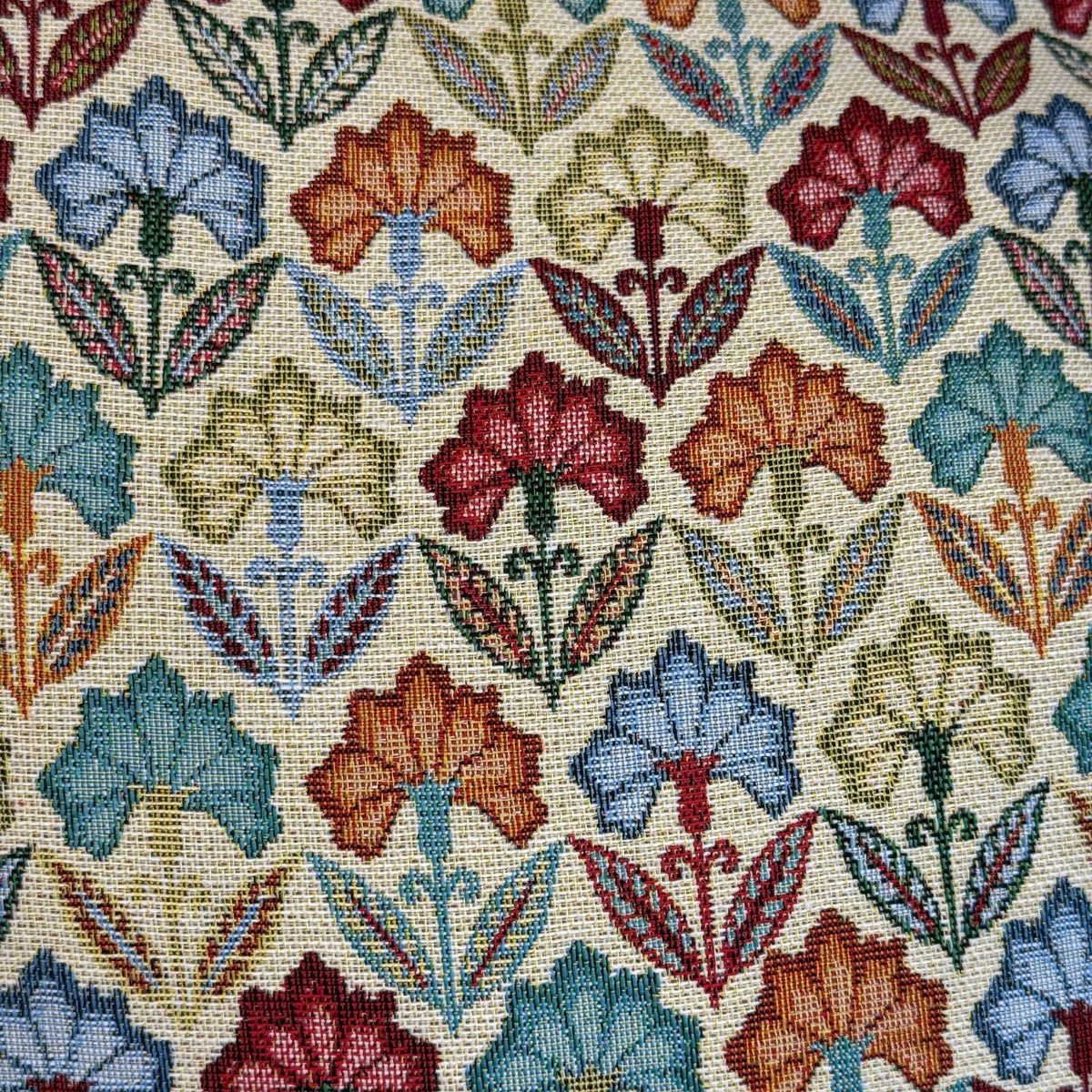 Experience timeless charm with the DE LA MUR LINE US Inc Floral Jacquard Small Makeup Bag – Multicolor (Flora). This small pouch features a symmetrical, geometric design with vibrant blue, red, yellow, and green flowers and leafy accents on cream woven fabric. The vintage-inspired floral pattern makes it an elegant and decorative choice for storing your makeup or daily essentials.