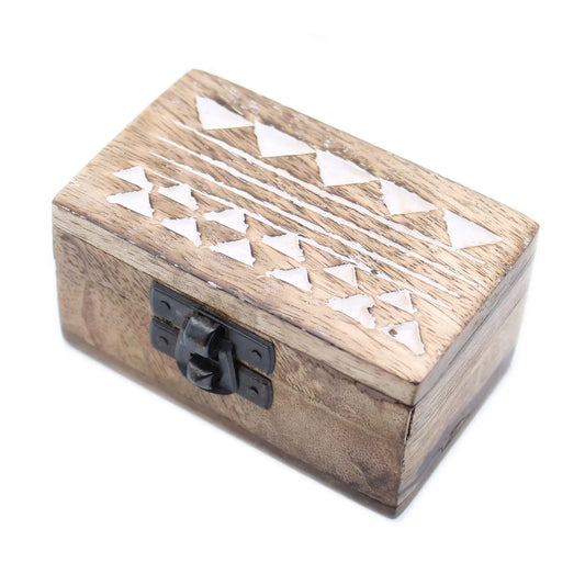 Wooden box with geometric cutout design and black latch on a white background