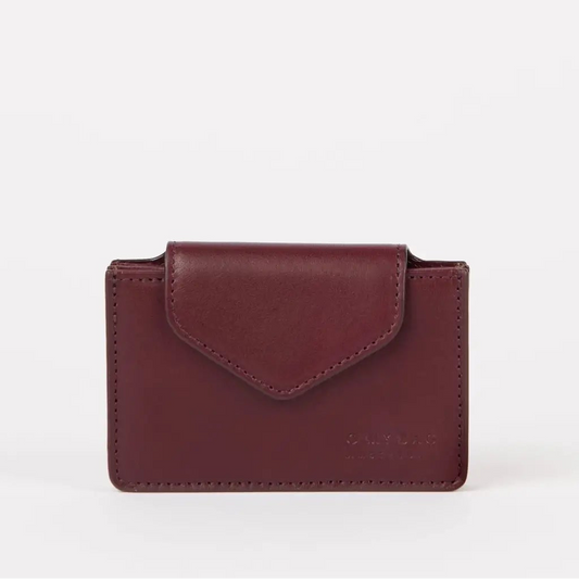 The Harmonica Wallet - Dark Cherry Classic Leather by O My Bag is a maroon leather cardholder with a flap closure, displayed against a plain white background.