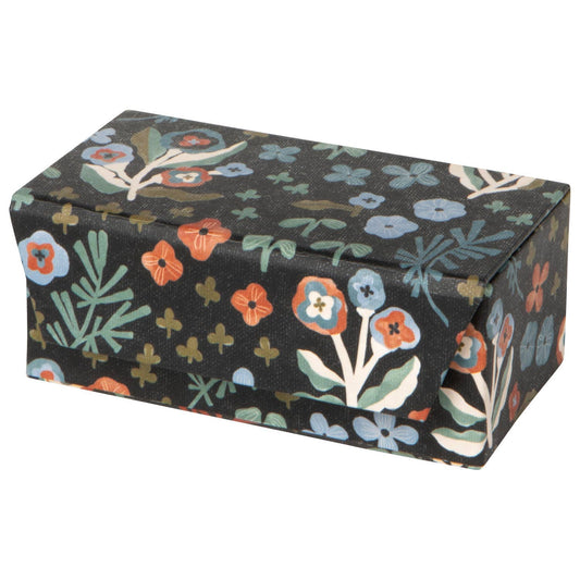 Dogwood Travel Jewelry Case in black with a multicolored floral pattern, crafted from a rectangular, lightweight recycled cotton paper design.